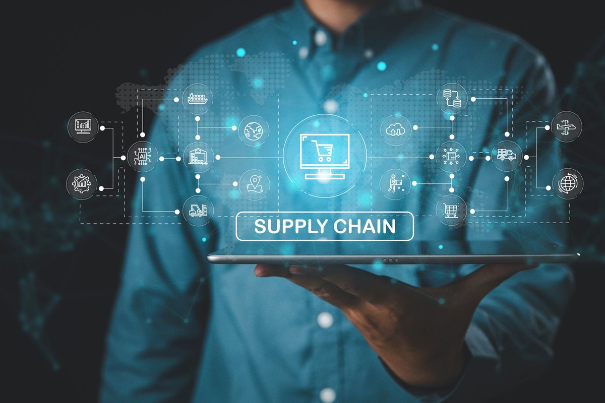 A graphic of a businessman holding a supply chain graphic.
