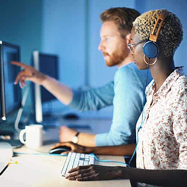 Business people working with data on computers