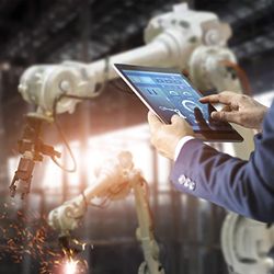Manager using tablet to control automation robot