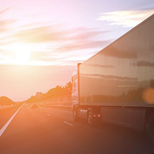 Cargo container truck highway road rural countryside sunset