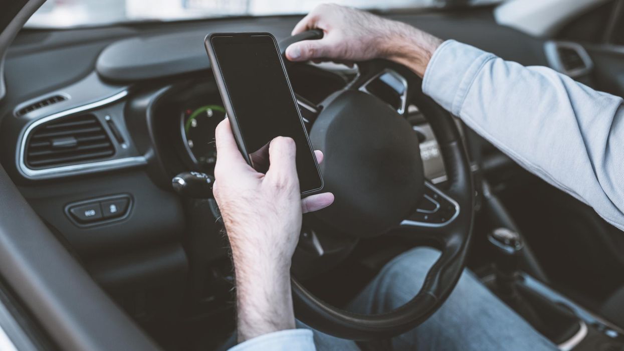 driver using mobile phone while driving