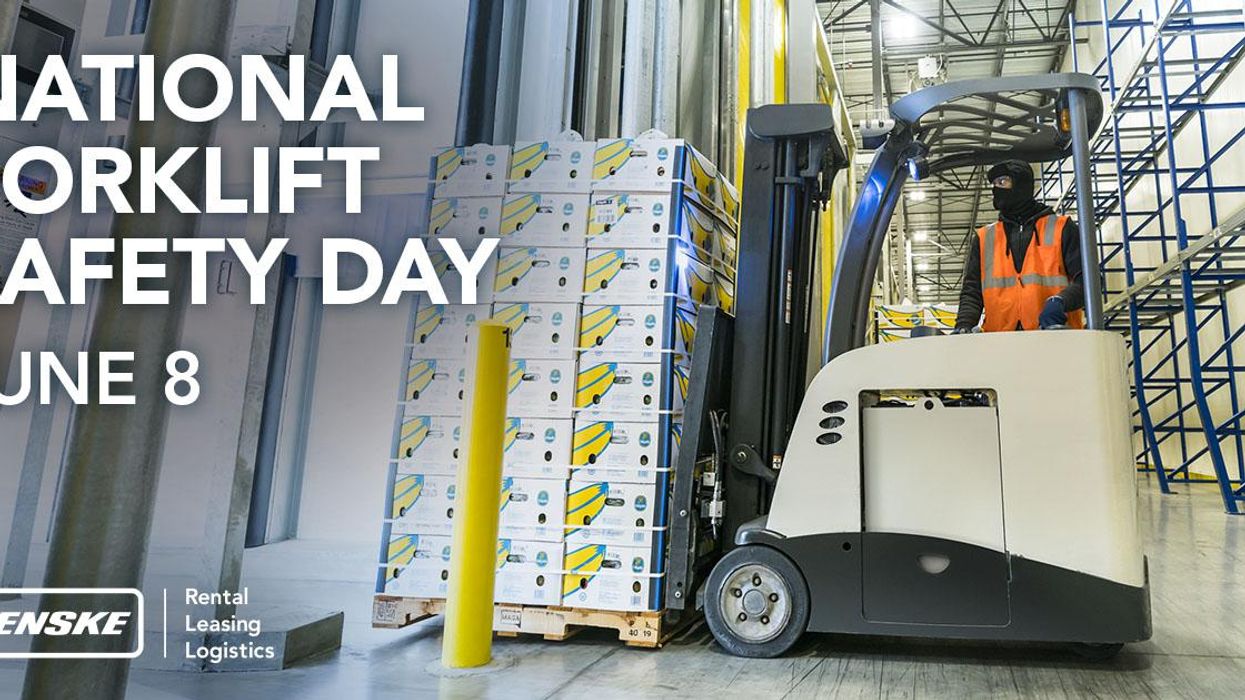 penske associate driving forklift in warehouse