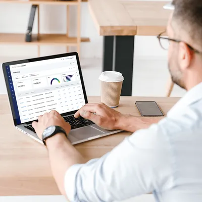 Man working on analytics on laptop