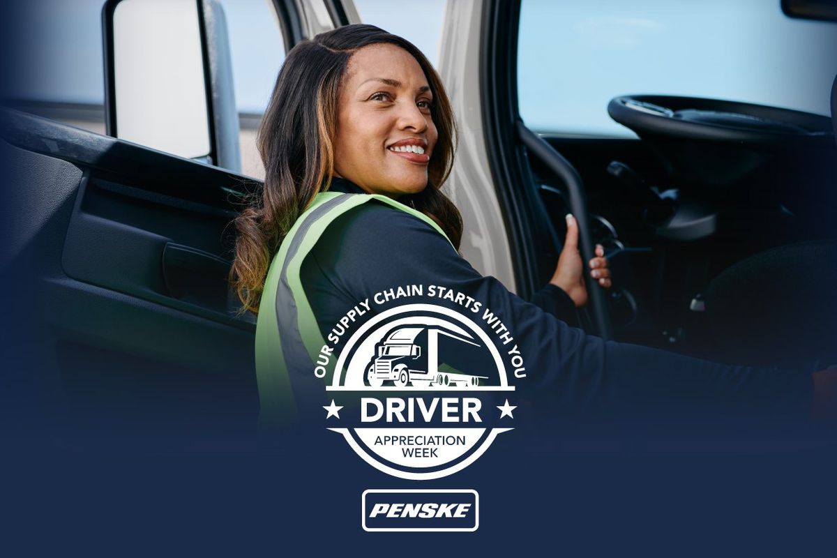 Female driver getting into a Penske truck. 