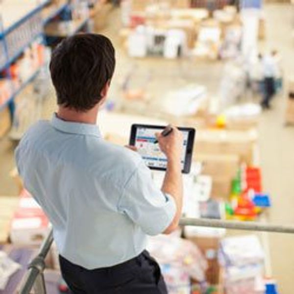 Man in warehouse with tablet