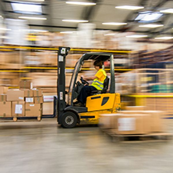 Moving forklift in a warehouse