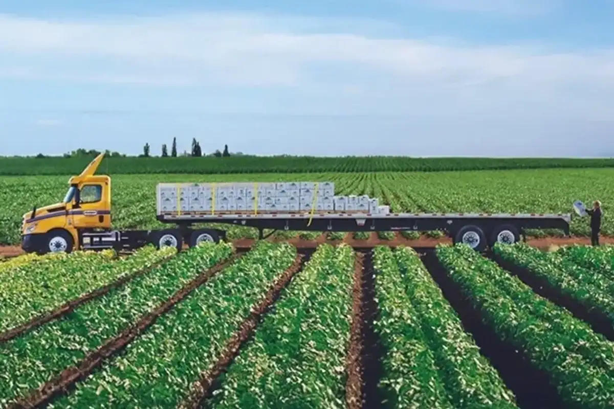 Penske truck in a field