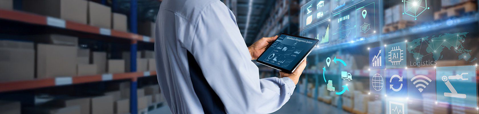 Person looking at a tablet inside a warehouse